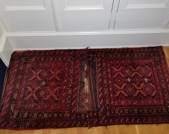 Set of two antique saddlebags 1920s Knotted saddlebags | Rug saddlebags | Two small rugs | Wool floor rugs from West Asia or Middle East