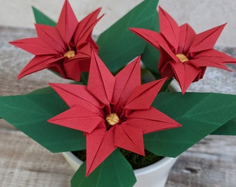 折り紙のポインセチア、手作りのクリスマスプレゼント、陶器の鉢植えの造花、ルビーの結婚記念日