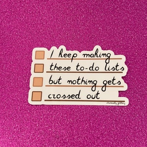 May include: A sticker with a to-do list that says "I keep making these to-do lists but nothing gets crossed out." The sticker is on a pink sparkly background.