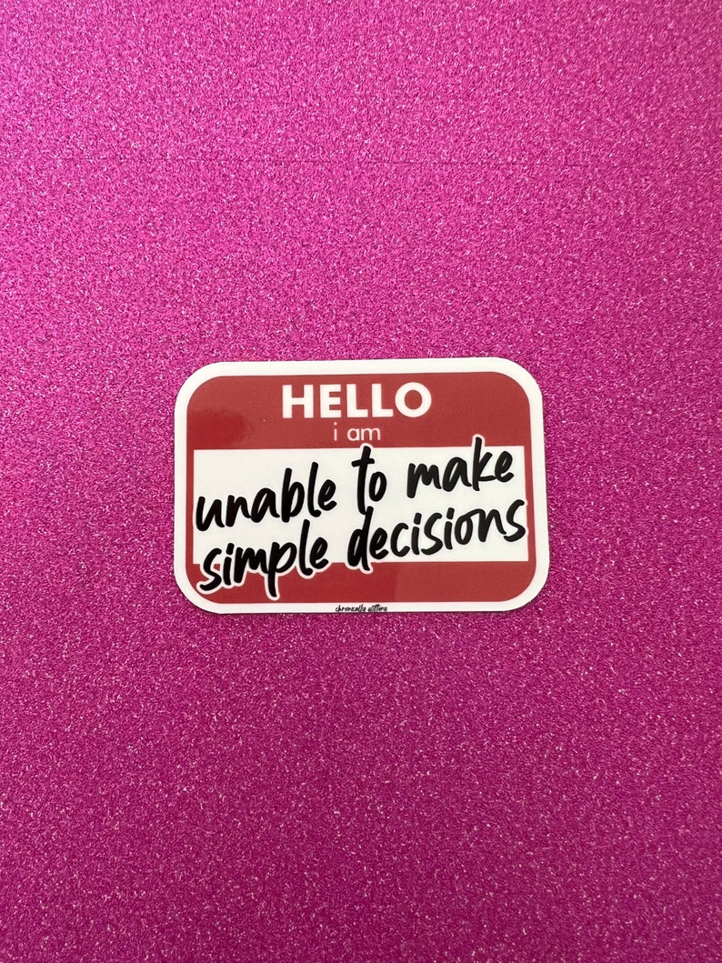 May include: A red and white sticker with the text "HELLO I am unable to make simple decisions".