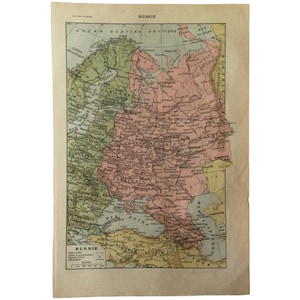 May include: Antique map of Russia, featuring detailed geographical information. The map is printed on aged paper with a beige background. The map uses a variety of colors to distinguish regions, including green, pink, and yellow. The title "Russie" is visible at the top.