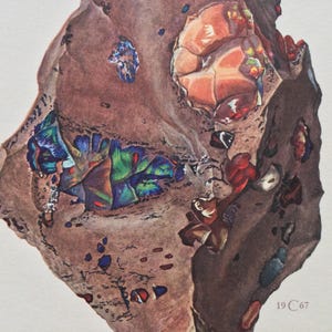 May include: A detailed watercolor illustration of a brown rock formation featuring embedded iridescent mineral deposits in shades of blue, green, and orange. The artwork includes the small printed text 19 C 67 in the lower right corner.