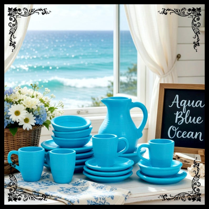 May include: A turquoise ceramic tableware set, including cups, saucers, bowls, and a pitcher, is arranged on a table. The set is complemented by a floral arrangement and a chalkboard sign that reads "Aqua Blue Ocean".