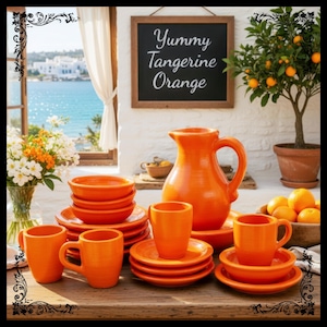 May include: A vibrant orange ceramic tableware set, including plates, bowls, and mugs, is arranged on a wooden table. A matching pitcher and a sign that reads "Yummy Tangerine Orange" are also present. A small tangerine tree is in the background.