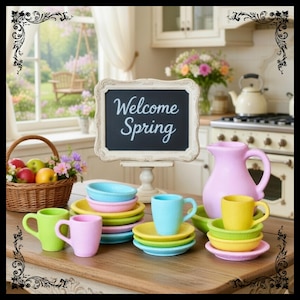 May include: A charming kitchen scene with a chalkboard sign that reads "Welcome Spring." Colorful ceramic cups, plates, and bowls in pastel shades of pink, yellow, blue, and green are arranged on a wooden surface. A pink pitcher and a basket of fruit and flowers complete the spring theme.