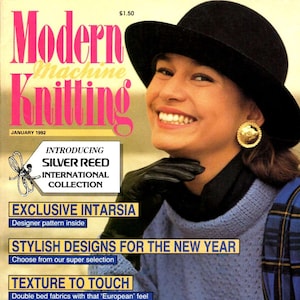 May include: A magazine cover featuring a woman wearing a black hat and a blue sweater. The magazine is titled "Modern Machine Knitting" and the cover text includes "Introducing Silver Reed International Collection", "Exclusive Intarsia", "Stylish Designs for the New Year", "Texture to Touch", "Second Hand Machines", and "Advertise FREE in our classified section".