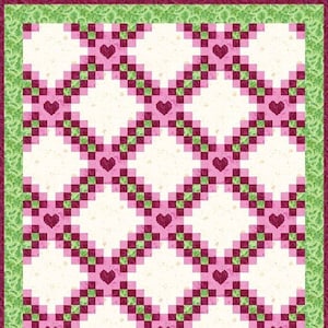 以下が含まれることがあります： ピンクとグリーンの正方形が繰り返されるパターンでできたキルト。正方形は斜めに配置され、各正方形の中心にひし形が作られています。キルトはグリーンの縁取りで飾られています。