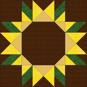 Pode incluir: Um bloco de colcha com fundo marrom e um padrão de estrela amarelo e verde.