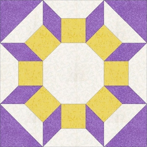 May include: A quilt block with a yellow and purple geometric pattern. The block is made up of squares and triangles, and the colors are arranged in a repeating pattern.