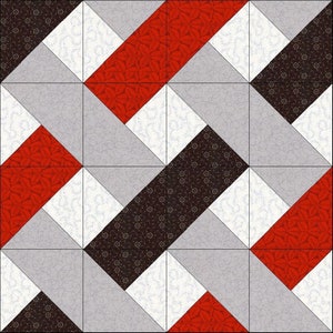 May include: A quilt block pattern with a geometric design featuring red, black, and white fabric squares. The fabric has a floral pattern.