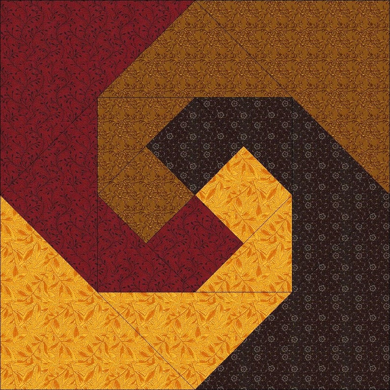 May include: A geometric quilt design featuring a spiral pattern. The quilt incorporates various fabrics in shades of red, gold, brown, and dark brown. The fabrics have floral and geometric patterns. The quilt is made of multiple fabric pieces sewn together.
