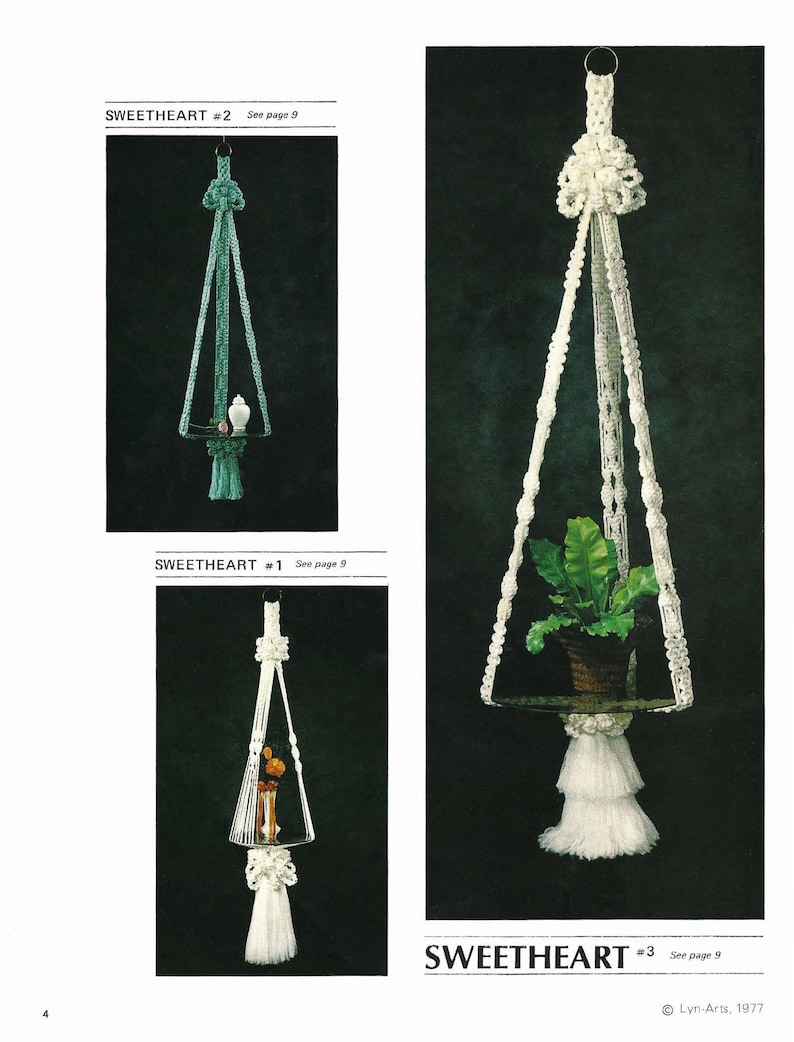 May include: Three macrame plant hangers, each with a different design. The first is white with a white tassel, the second is teal with a teal tassel, and the third is white with a white tassel. Each hanger has a shelf for a plant or other object.