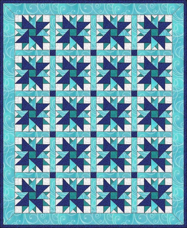 May include: A quilted textile featuring a repeating star pattern in shades of blue and teal. The stars are set against a white background and framed by a light blue border with a swirling design. The quilt is a square shape.