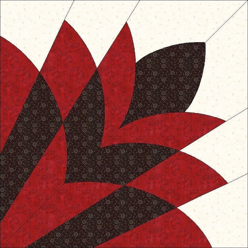 May include: A quilt block featuring a stylized floral design. The design incorporates red, black, and cream-colored fabrics. The red fabric has a solid texture, while the black fabric has a floral pattern. The cream-colored fabric is in the background.