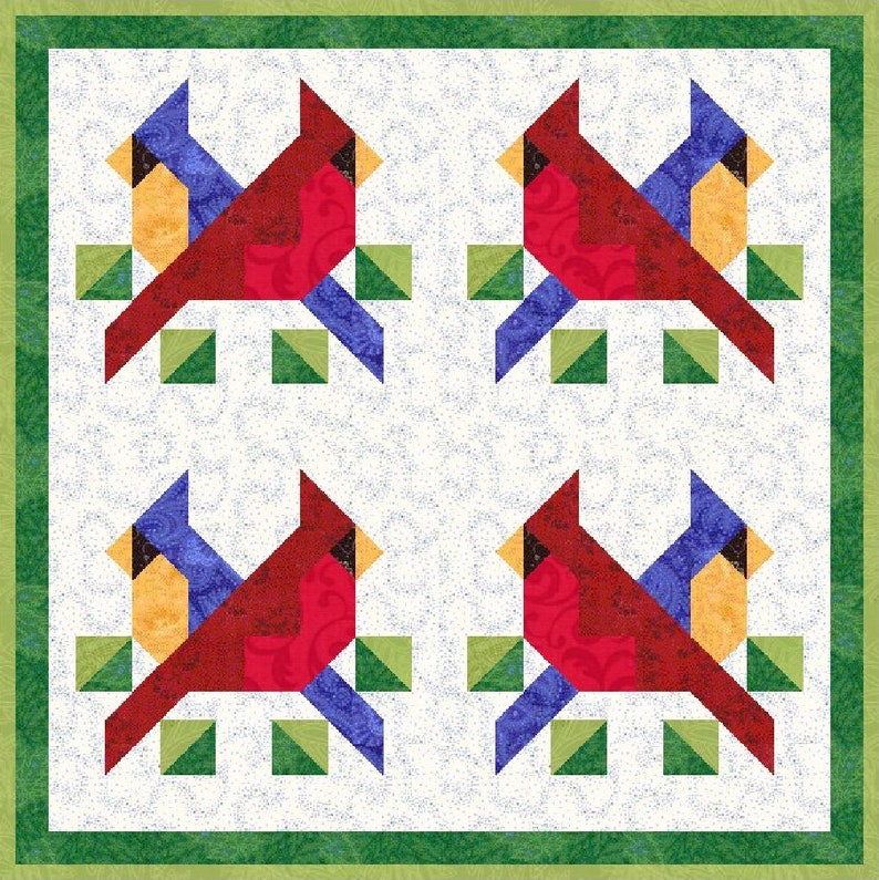 May include: A square quilt featuring four cardinal bird designs. Each cardinal is red with black accents, perched on a blue and green geometric branch. The background is white with a subtle speckled pattern, framed by a green border.