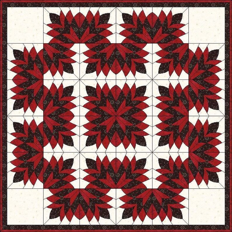 May include: A square quilt featuring a repeating floral pattern in shades of red and dark brown against a cream background. The quilt is bordered with a dark red and cream floral pattern. The design is symmetrical and geometric.