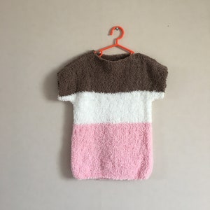 Baby dress knitted in soft wool
