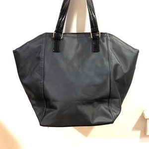Victoria&#39;s Secret - A large dark grey stiffened fabric tote with shiny black trim and silver toned metal details. Fashionista&#39;s delight!