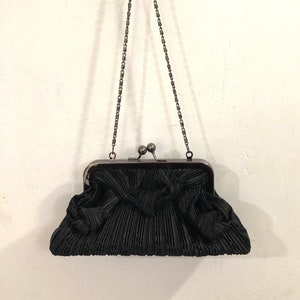 Moni Couture -  A sophisticated textured black satin evening clutch/handbag with decorative knots of the same fabric - beautifully crafted!