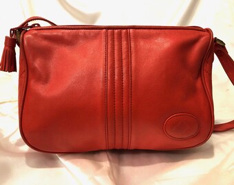 Liz  Claiborne - A gorgeous supple salmon colored genuine leather cross body bag with an adjustable strap. Beautifully crafted!