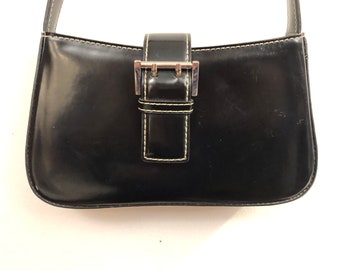 Nine  West - A handsome smooth black leatherette handbag with white accented stitching
