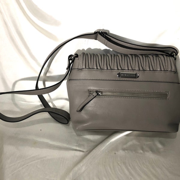 Max Studio - A pearly gray cross body bag with a decorative textured flap which opens to a "pouch" - loaded with style and organization