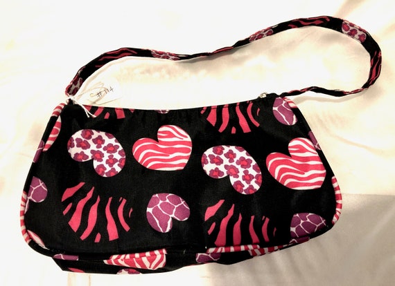 A happy zippered purse with lots of "heart". It's… - image 1