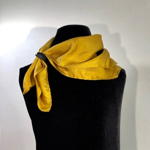 A bronze toned soft, smooth silky, comfortable, versatile all occasion &quot; necktie&quot; scarf.