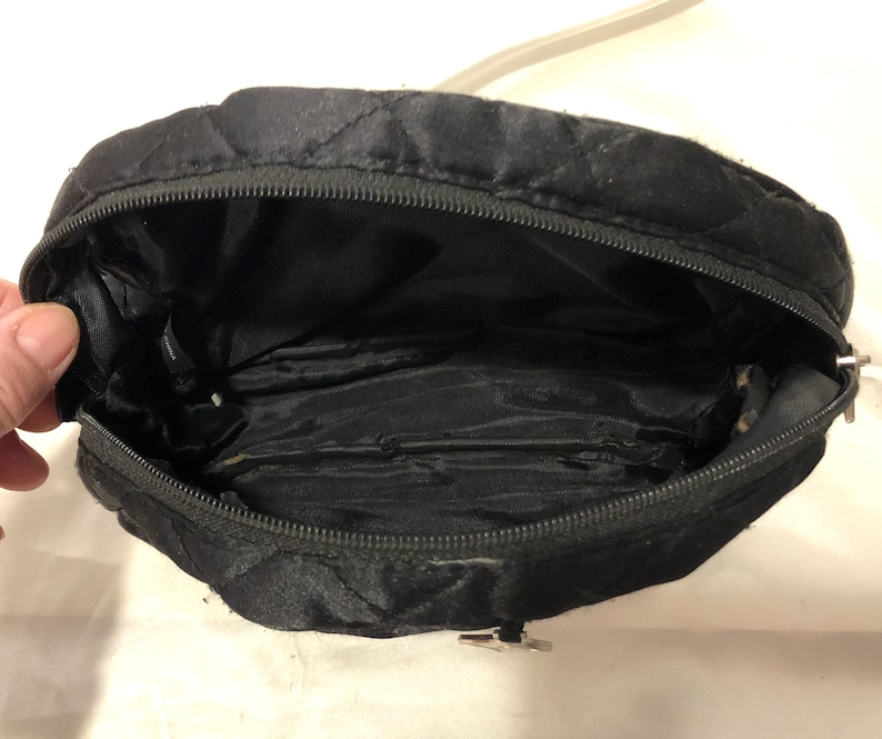 A Puffy Black Soft Quilted Evening/cosmetic Bag With Silver