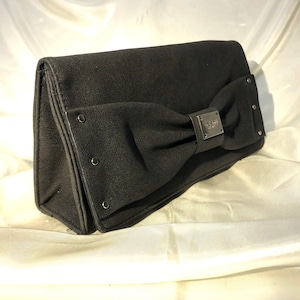 Victoria&#39;s Secret - An elegant charcoal bag with a subtle metallic sparkle, chic decorative bow on the front with Victoria&#39;s Secret plaque