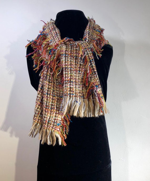 A Loosely Woven Colorful, Scarf featuring a medle… - image 1