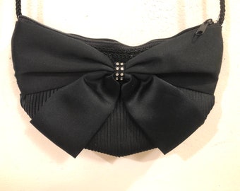 Pacific  Express - A very charming cross body black satiny puffy evening bag with a gorgeous rhinestone encreusted oversized bow in front