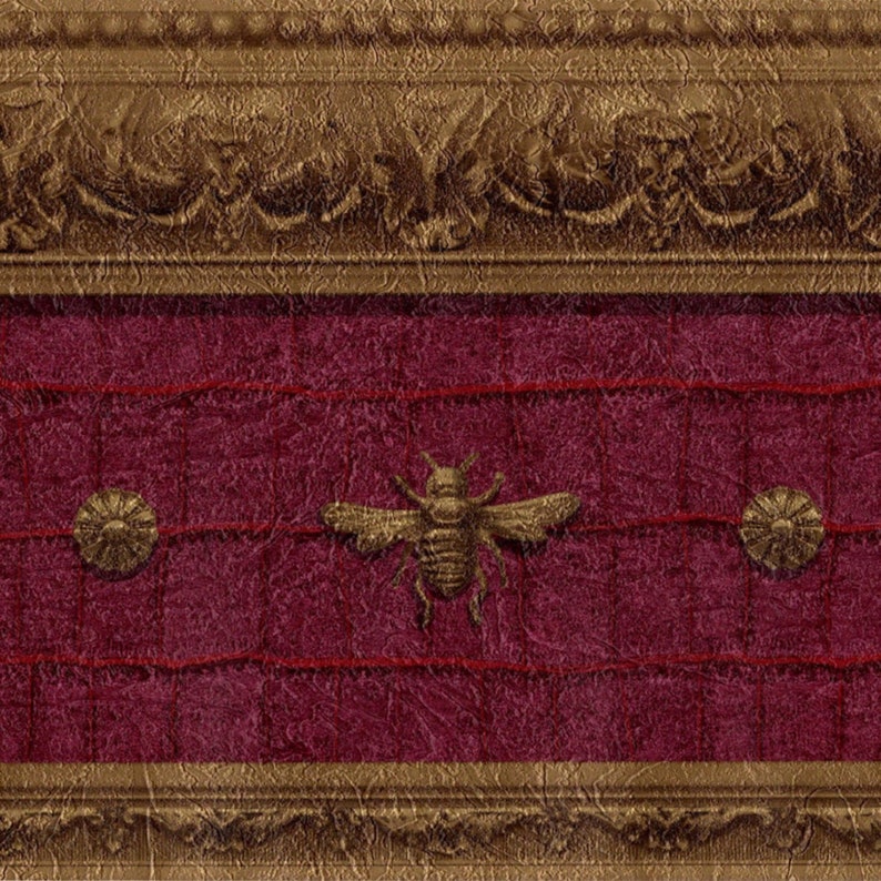 Close-up of the Raymond Waites Napoleonic Bee wallpaper border showing detailed faux leather texture and burnished gold embossed bee pattern.