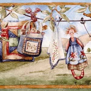May include: A decorative border featuring a whimsical scene with a patchwork quilt, a bag labeled "Pegs", and a cloth with floral embroidery hanging on a clothesline. An angel doll with wings and a halo is also present, along with a small bird.