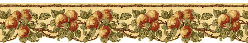 May include: A beige and brown patterned fabric border with a repeating design of green leaves and red and yellow apples.