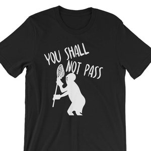 May include: Black t-shirt with a white silhouette of a lacrosse player holding a lacrosse stick and the text "YOU SHALL NOT PASS".