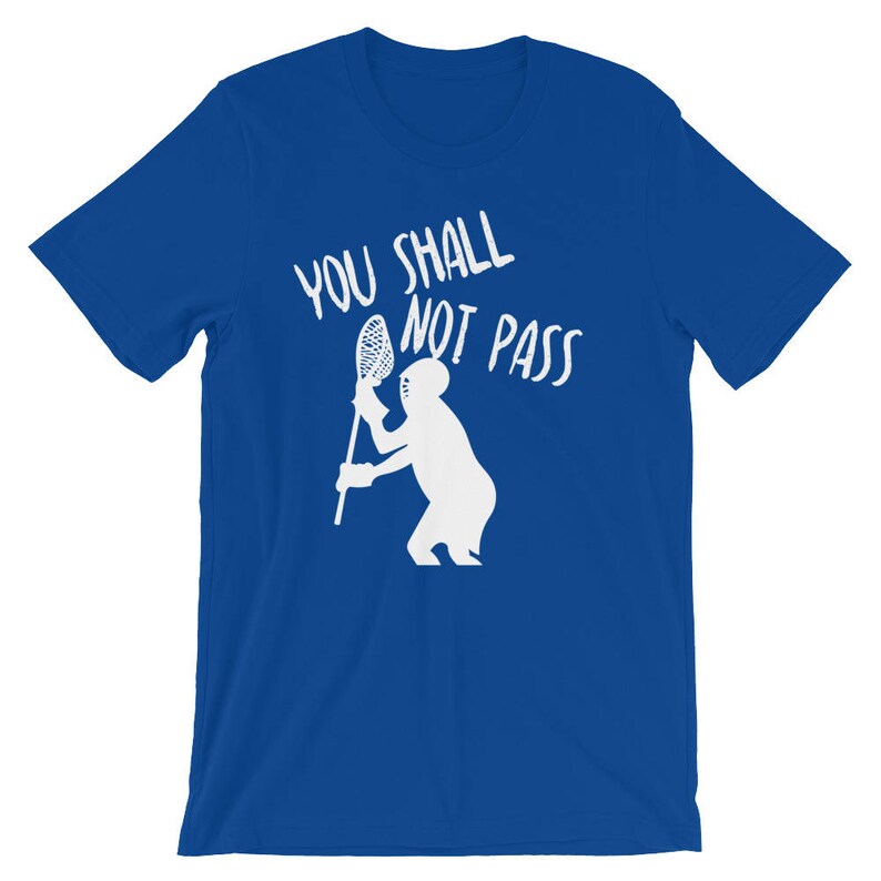 May include: A royal blue t-shirt with white text that reads "You Shall Not Pass" and a white silhouette of a lacrosse player holding a lacrosse stick.