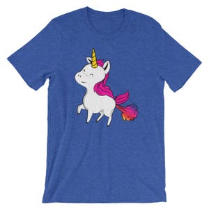 May include: A blue t-shirt with a cartoon unicorn with a rainbow colored tail farting.