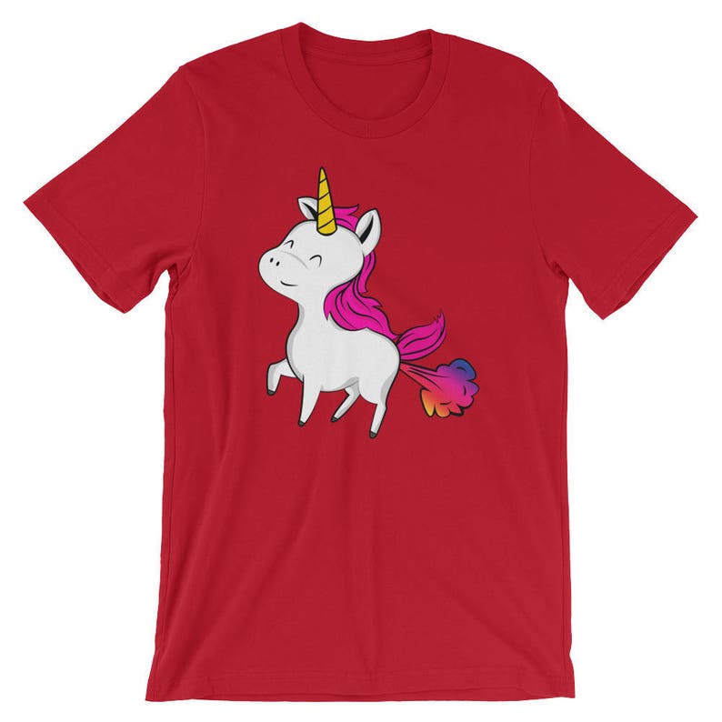 May include: Red t-shirt with a cartoon unicorn with a rainbow colored fart. The unicorn is white with a pink mane and a yellow horn.