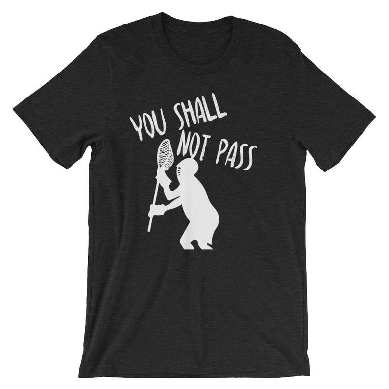 May include: A black t-shirt with a white silhouette of a lacrosse player holding a lacrosse stick and the text "You Shall Not Pass".