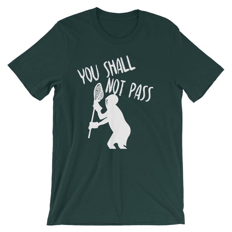 May include: A dark green t-shirt with a white graphic of a lacrosse player holding a lacrosse stick and the text "You Shall Not Pass".