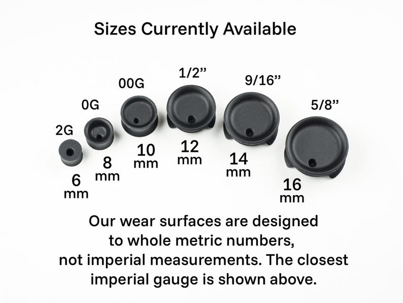 May include: A set of black rubber ear gauges in various sizes, ranging from 6 mm to 16 mm. The sizes are labeled in both metric and imperial measurements. The text reads "Sizes Currently Available".