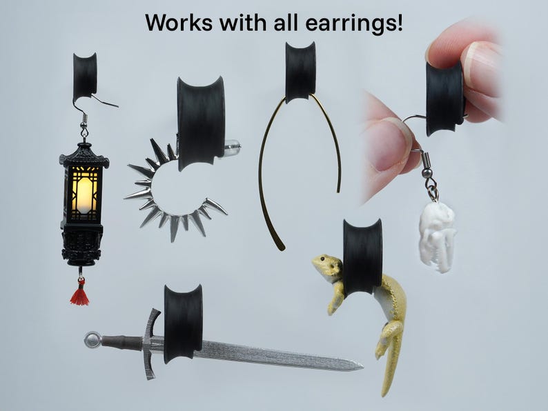 May include: Black silicone earring backs that can be used with a variety of earrings. The backs are shown holding a variety of earrings, including a lantern, a sword, a ring, a thin wire earring, and a small white figurine.