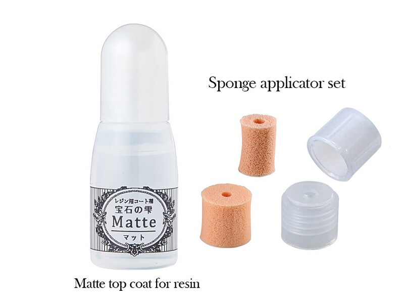 May include: A clear bottle of matte top coat for resin with a white cap, alongside a sponge applicator set. The bottle has Japanese text and the word "Matte". The set includes two sponge applicators and two clear caps.