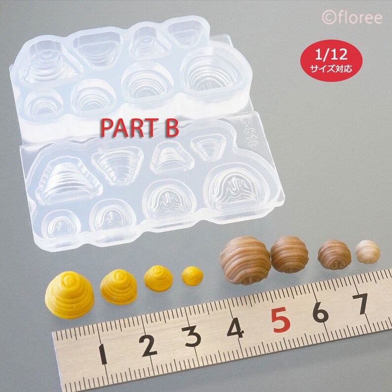 May include: A clear silicone mould with 12 different shapes for making miniature food items. The mould is labelled "PART B". The image also shows several miniature food items made with the mould, ranging in size from 1 to 7 centimetres.