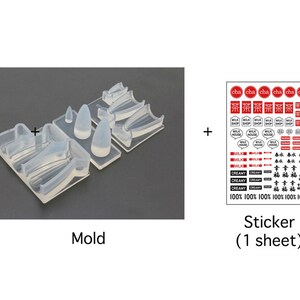 May include: A clear silicone mold for making resin crafts, with a sheet of stickers featuring Japanese text and images of milk, tea, and cream. The stickers are red and black on a white background.