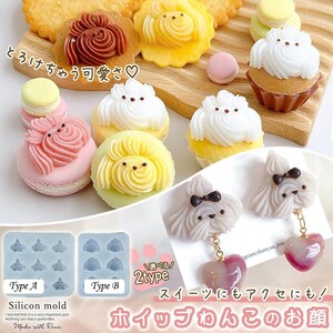May include: An assortment of dog-shaped desserts and accessories. The treats include cookies, cupcakes, and macarons, decorated with white, yellow, and pink frosting. The accessories are earrings with heart-shaped charms. The image also shows silicone molds.