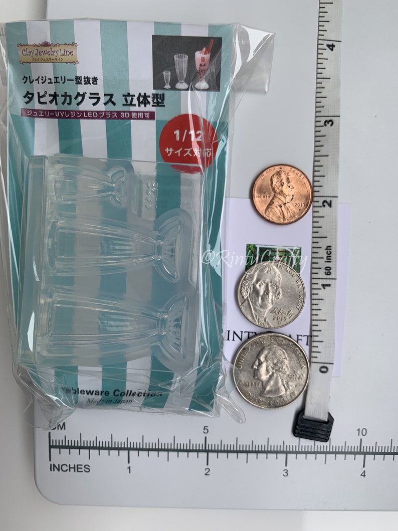 May include: Clear plastic mold for making miniature tapioca bubble tea glasses. The mold is 1/12 scale and is designed for use with UV resin or LED resin. The mold is packaged in a clear plastic bag with a green and white striped background. The package also includes a picture of three miniature tapioca bubble tea glasses.