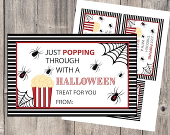May include: A printable Halloween treat bag tag with black and white stripes, a spider web design, and the text "Just popping through with a Halloween treat for you. From:"
