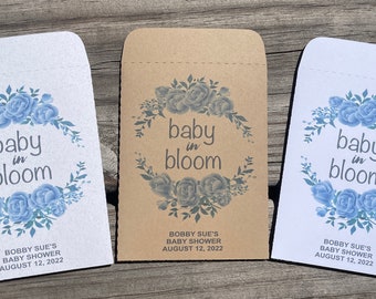 May include: Three white envelopes with blue floral designs and the text "baby in bloom" and "Bobby Sue's Baby Shower August 12, 2022".